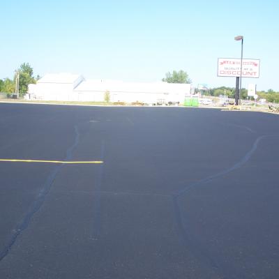 Sealcoating, Crack Sealing and Line Striping at L and M